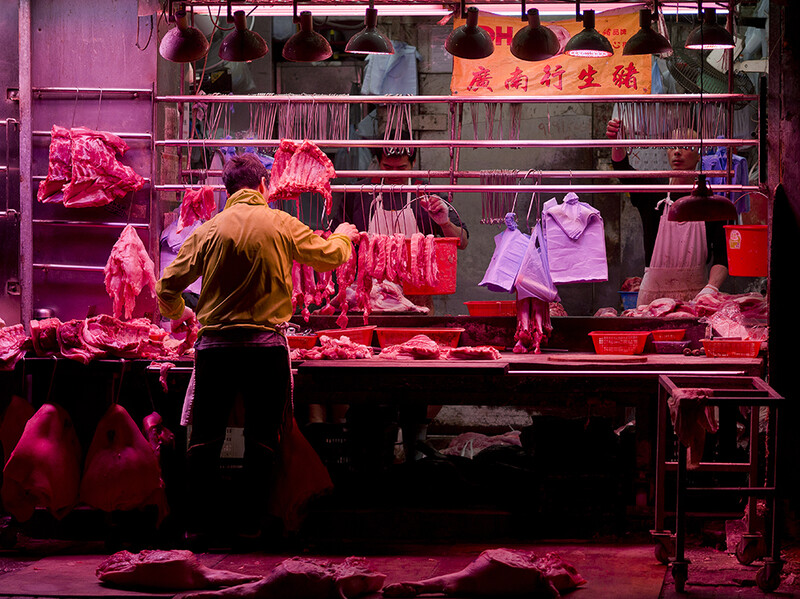 Butchers at work before the day begins in Sham Shui Po.