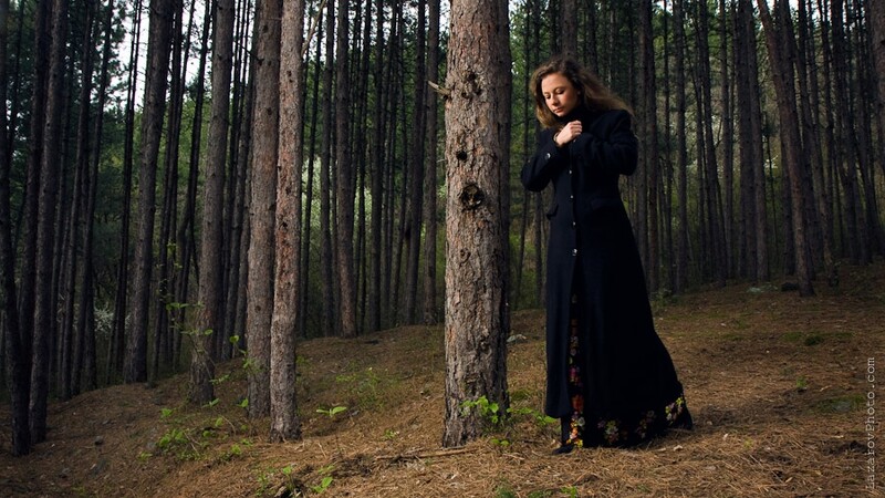 Young woman walking alone in the forest