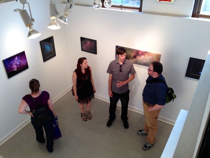 image of people standing around at an art gallery