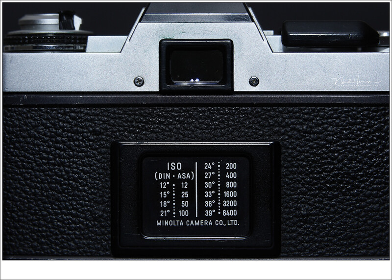 An old Minolta XG-1 with the ISO (DIN-ASA) table on the back. You had to set the film sensibility once for all the 12, 24, or 36 frames you had to your disposal.