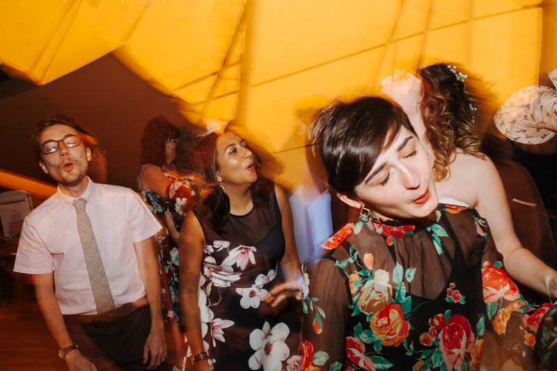 wedding guests dancing and singing