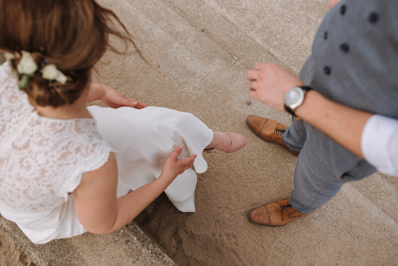 A bride and groom on the beach