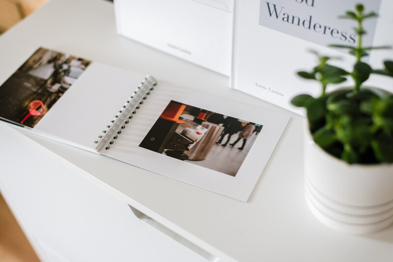 A photobook on a chest of drawers.