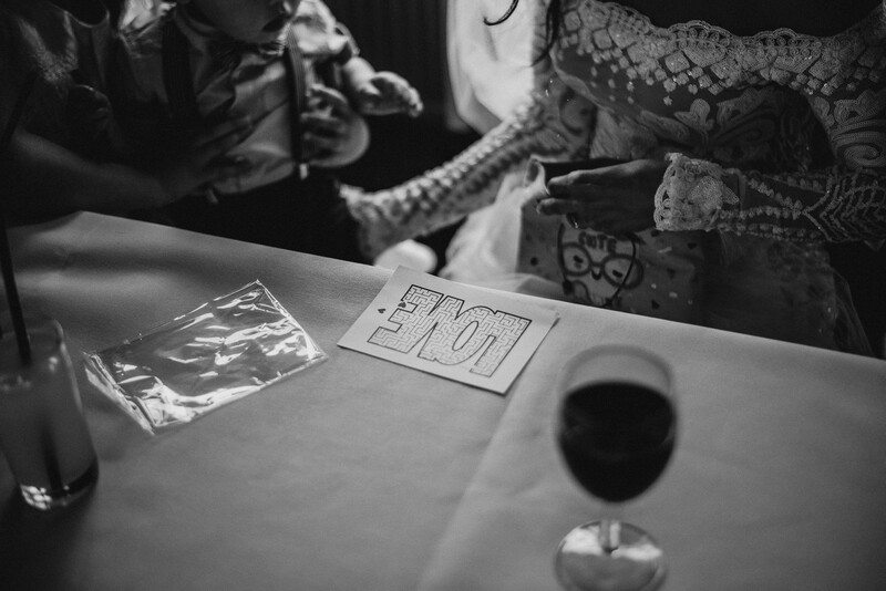A bride sat at a wedding breakfast table