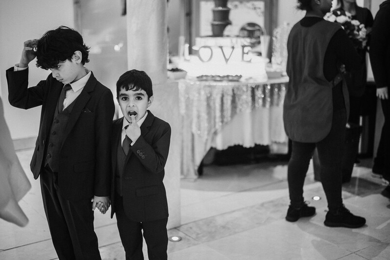 Two young boys at a wedding.