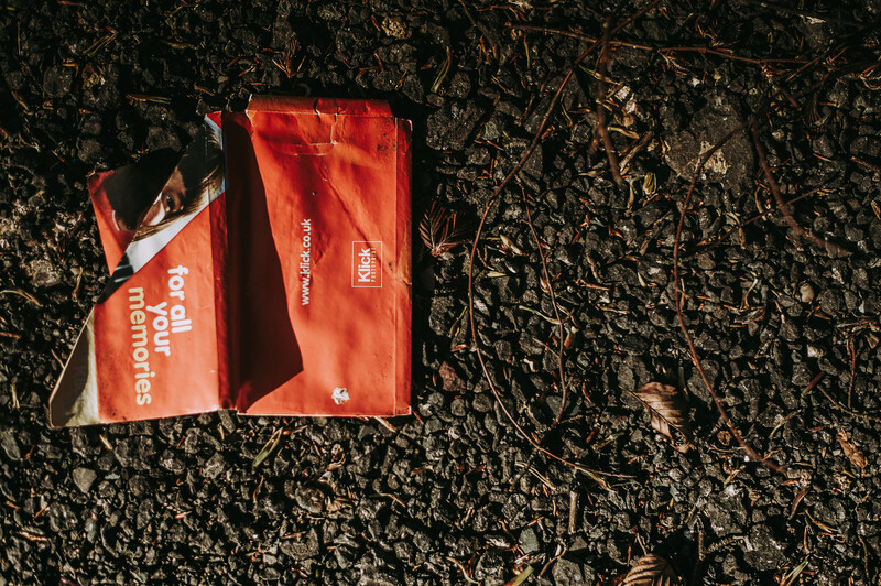 A red package discarded on the street