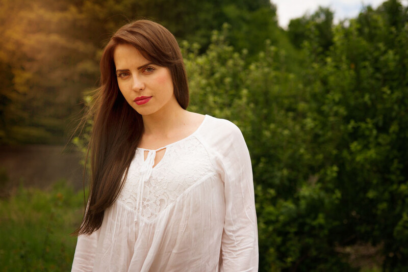 Natural light portrait with fake light flares from the wrong light direction