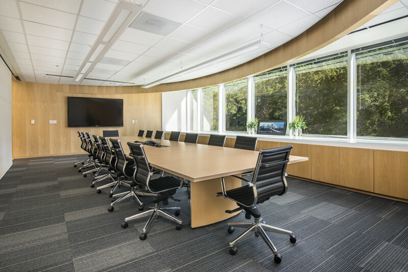 a meeting room with an empty conference table