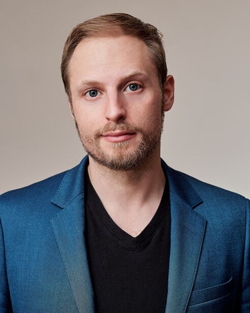 Simple headshot of toronto Magician Ben Train they retouched for me