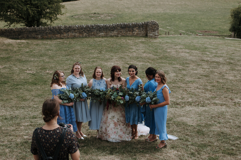 A group shot of bridesmaids and bride.