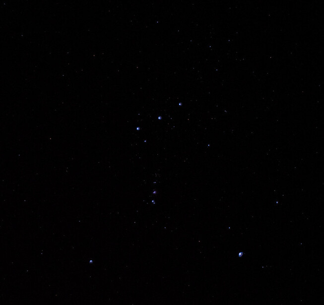An underexposed astro image of the Orion constellation