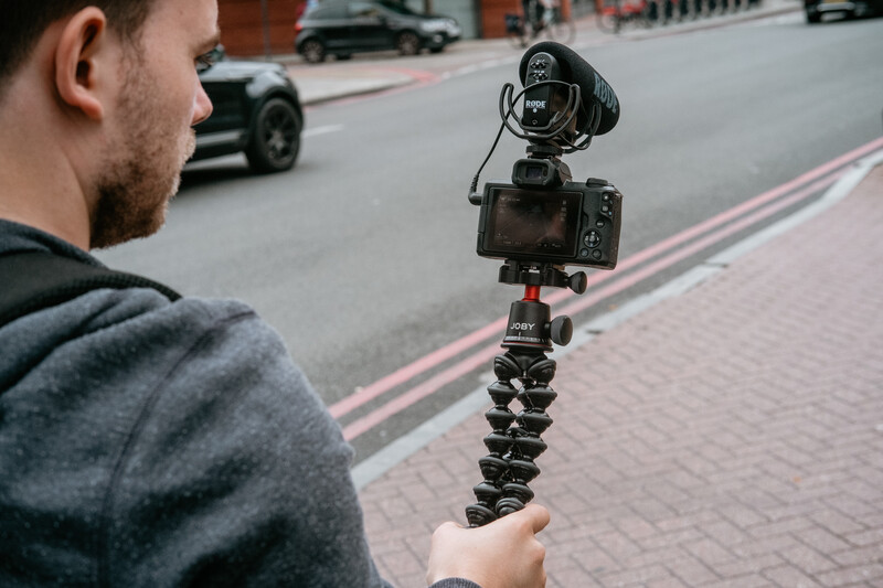 Black Joby tripod held 