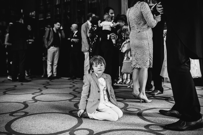 A young boy sat down at a wedding