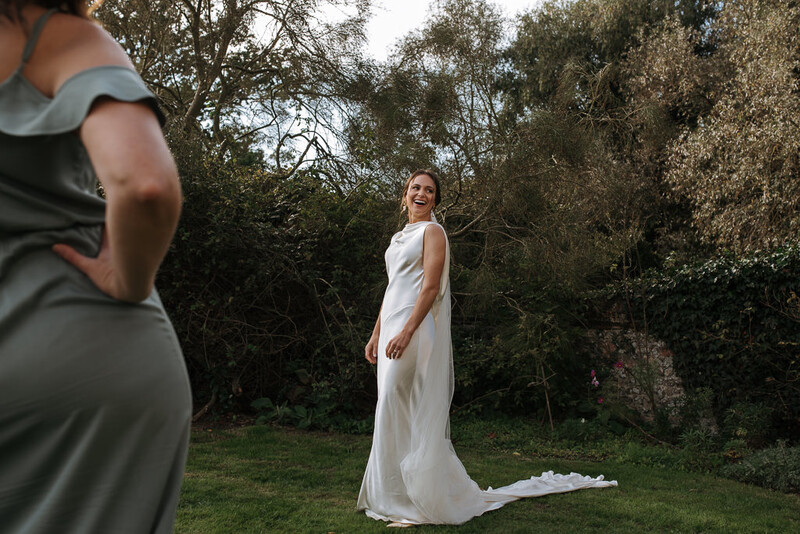 Bride and a guests on wedding venue grounds.