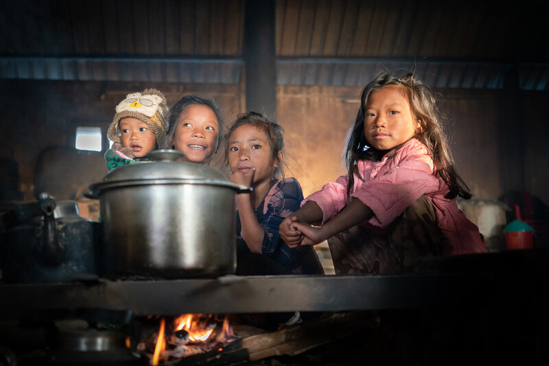Young children in a village kitchen