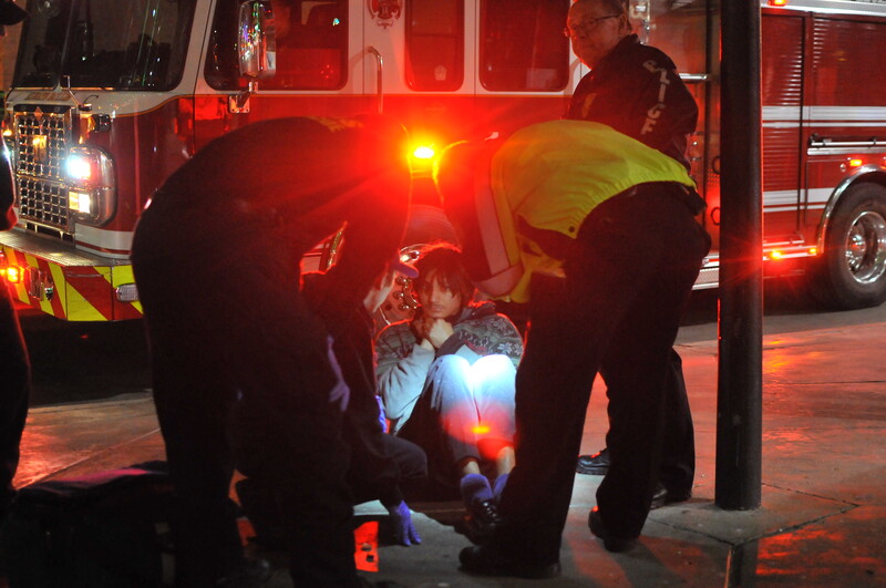 Paramedics attending a scene of an injured person. 