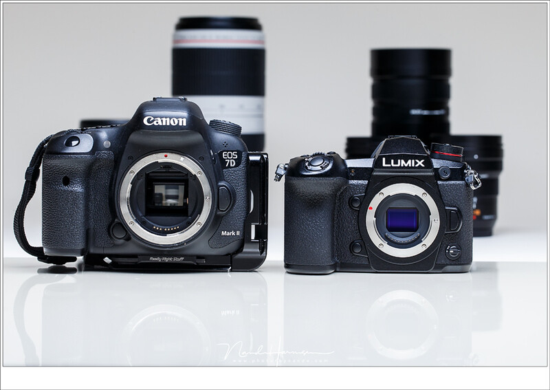 A small micro 4/3 mirrorless camera from Panasonic next to a Canon DSLR. Although the sensor size is a bit smaller, it shows how small a mirrorless camera can be. There are also mirrorless cameras with a full frame sensor that resemble the size of the Pan
