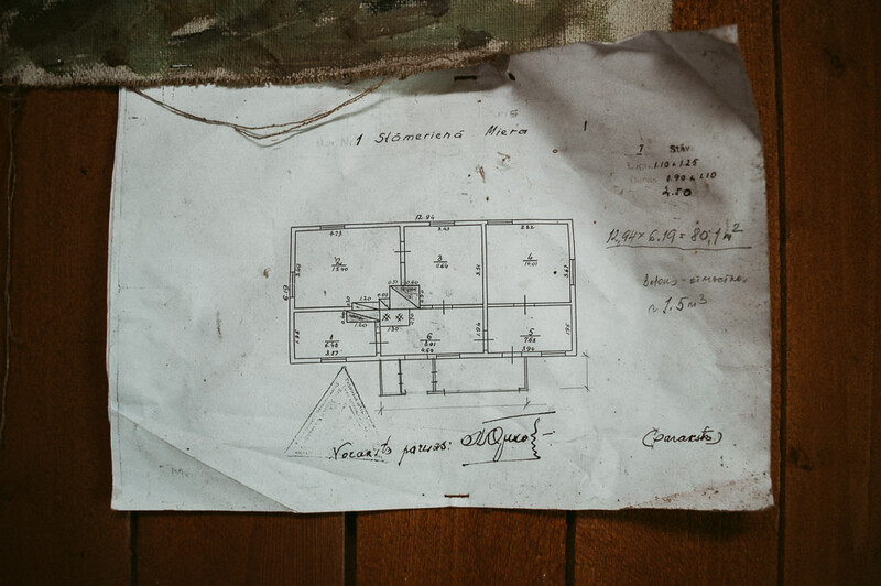 An old house plan attached to the wall.