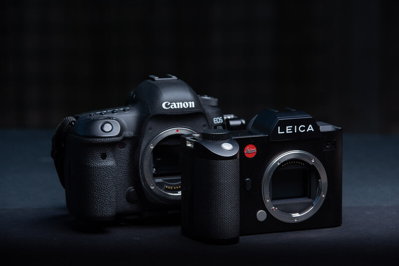 The Canon EOS 5D mark IV DSLR next to the Leica SL mirrorless camera. 