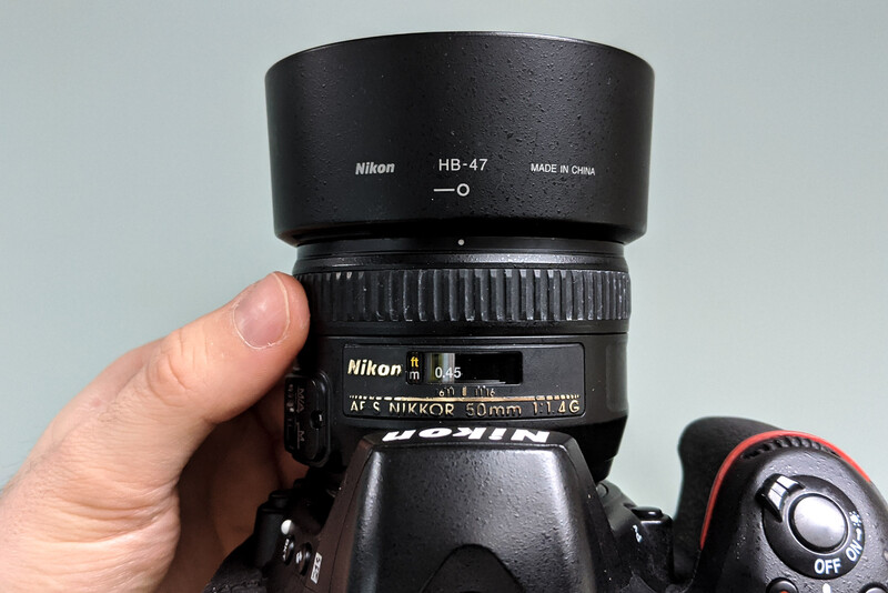 Adjusting the lens' focus ring until it's at the minimum focusing distance