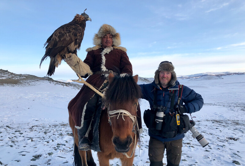 Stu McKenzie posing with a Kazakh Eagle hunter