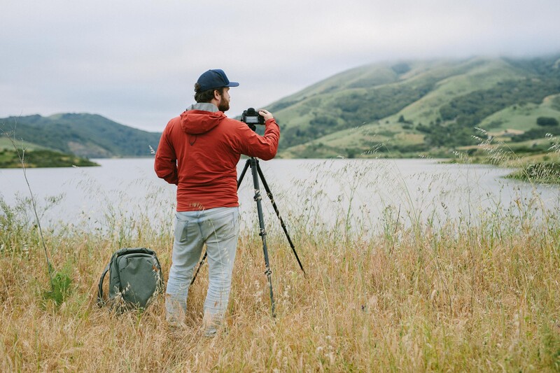 Peak Design Travel Tripod in Field Near Mountains
