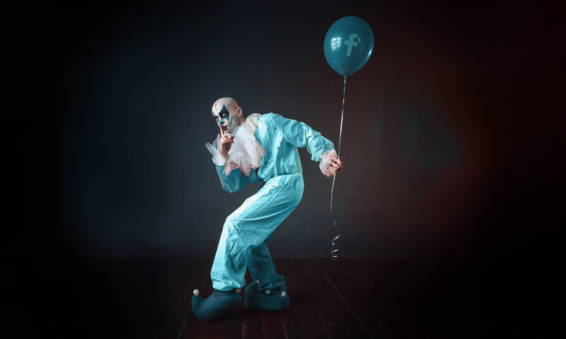 Facebook clown holding a ballon