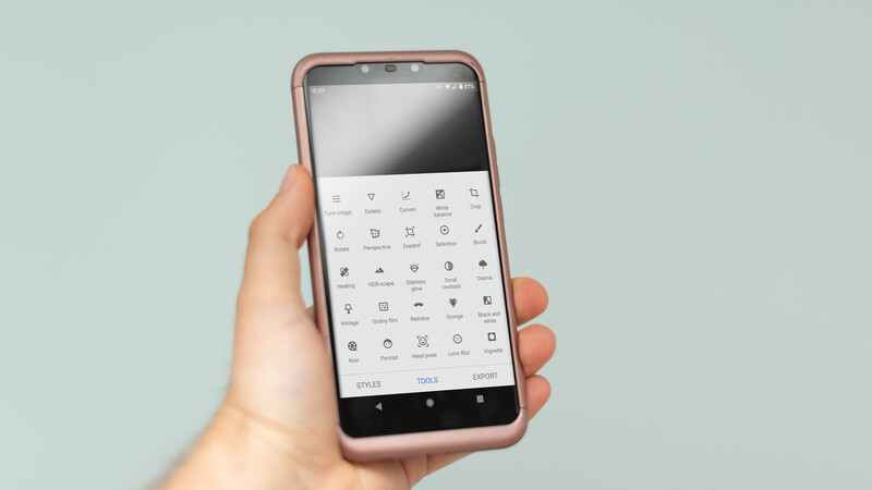 The tools panel in Snapseed is displayed on a smartphone