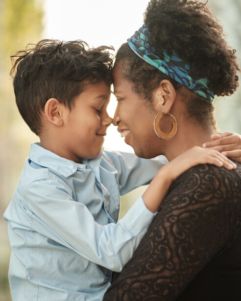 A backlit mother and son photo