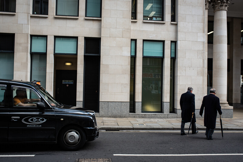Two men crossing the road in London