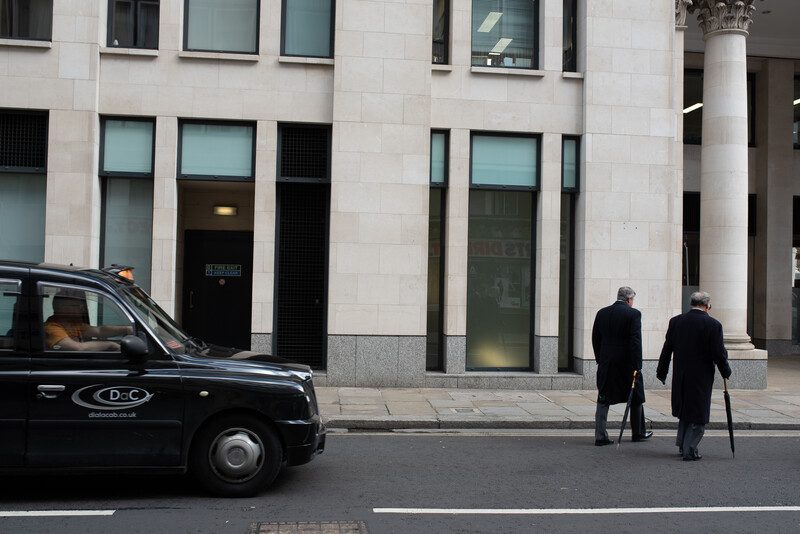 Two men crossing the road in London