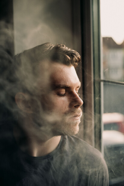 A man sat by the window.