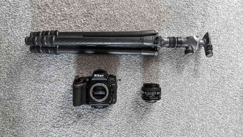 Tripod setup with camera and lens