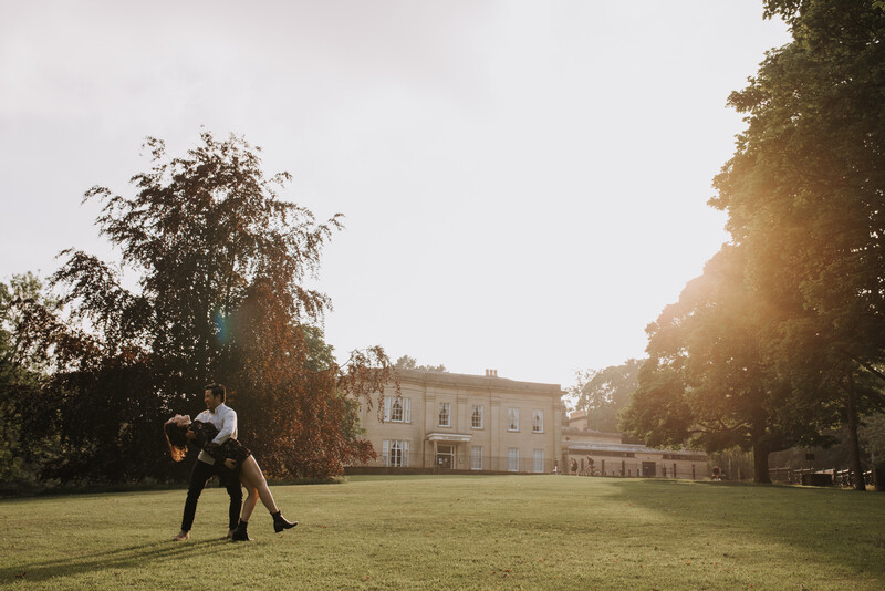 A young couple dancing in the sunset.