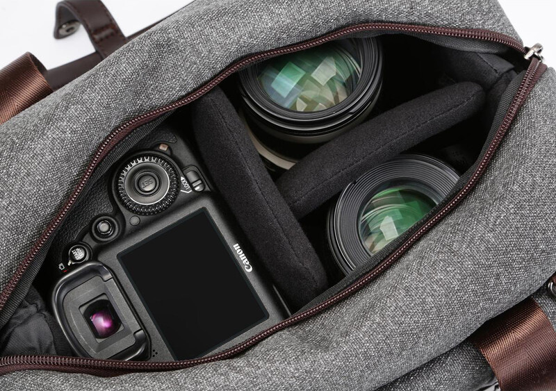 An open camera messenger bag with photographic equipment inside