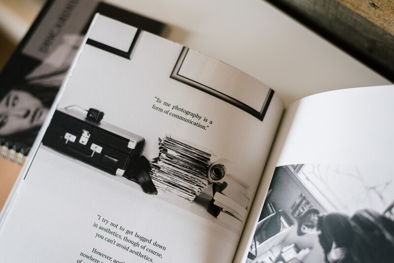 Several photography books on a table.