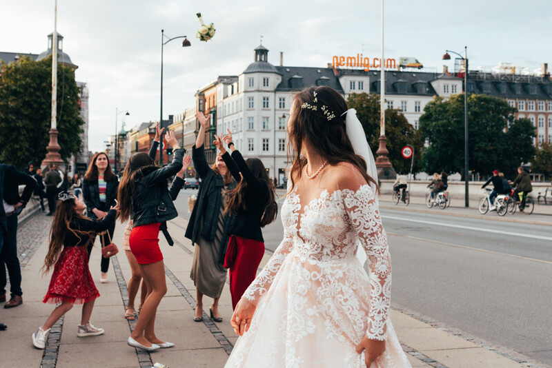 A bride throwing a bouquet of flowers