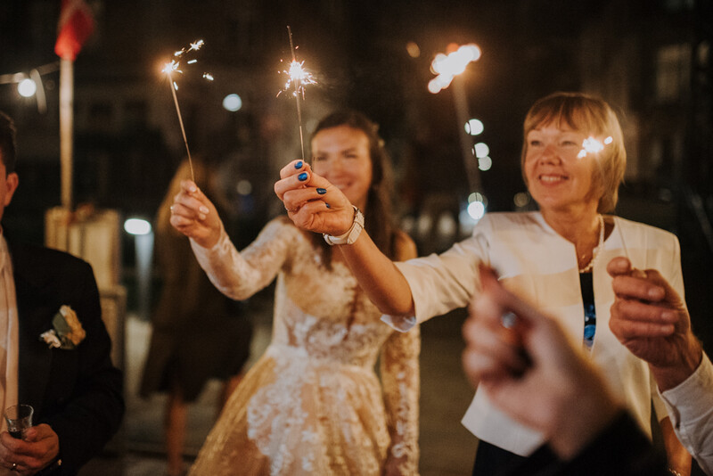 Wedding party celebrating with sprinklers.