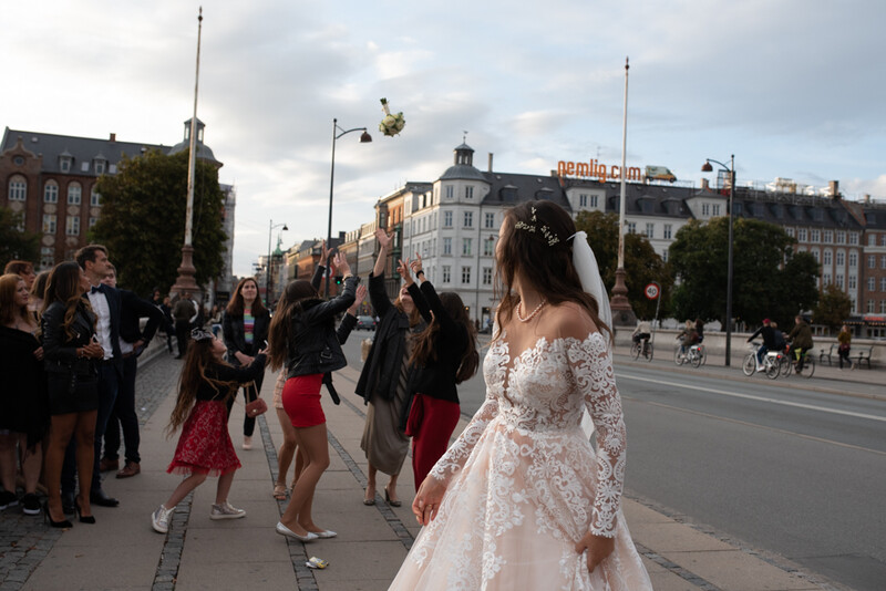 A bride throwing her bouquet of flowers