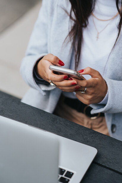 A woman working on a smartphone