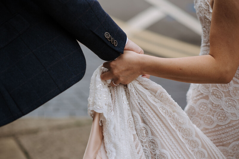 Bride and groom holding hands