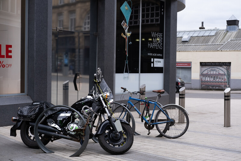 A parked up motorcycle on the street