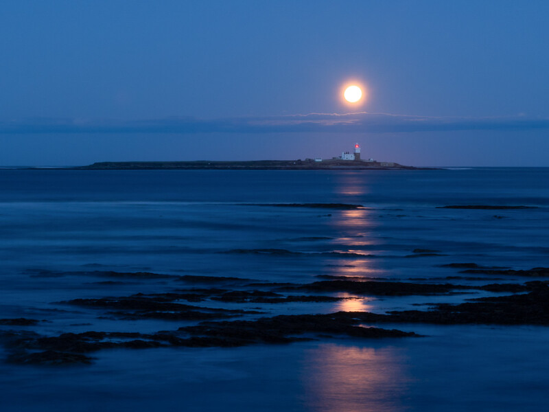 © Ivor Rackham A tiny splash of red from the lighthouse in the predominant blue after-dusk light draws one's eye to it.