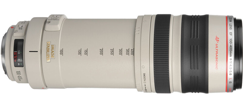 Canon EF 100-300mm telephoto zoom lens with white barrel and black focus ring.