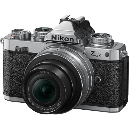 Nikon Z fc mirrorless camera with attached zoom lens, displayed against white background.