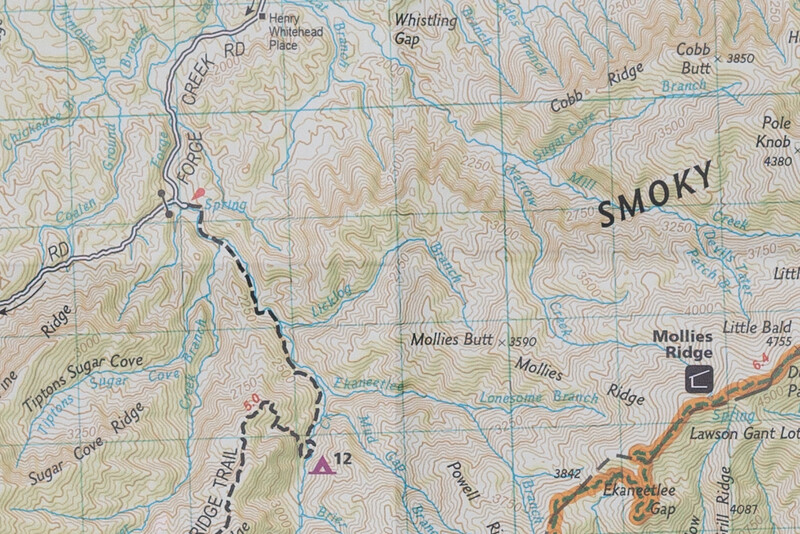 Topographic map showing a hiking trail marked with a dashed black line through mountainous terrain near the Great Smoky Mountains.