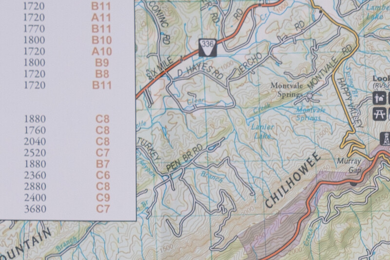 Topographic map with elevation reference chart showing contour lines and terrain features.