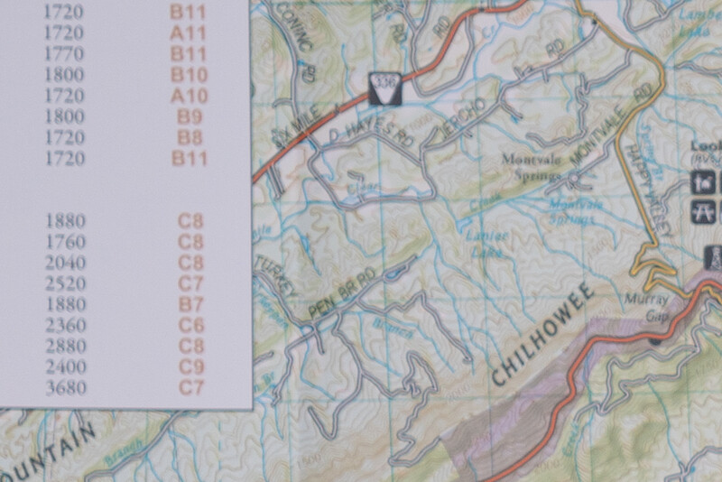 Topographic map with elevation reference chart showing contour lines and terrain features.