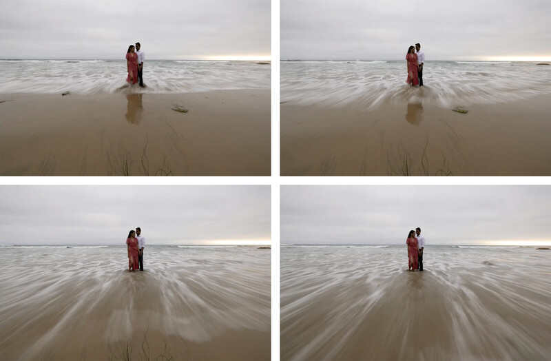 Woman in red dress standing in shallow ocean water with motion blur effect applied to waves.