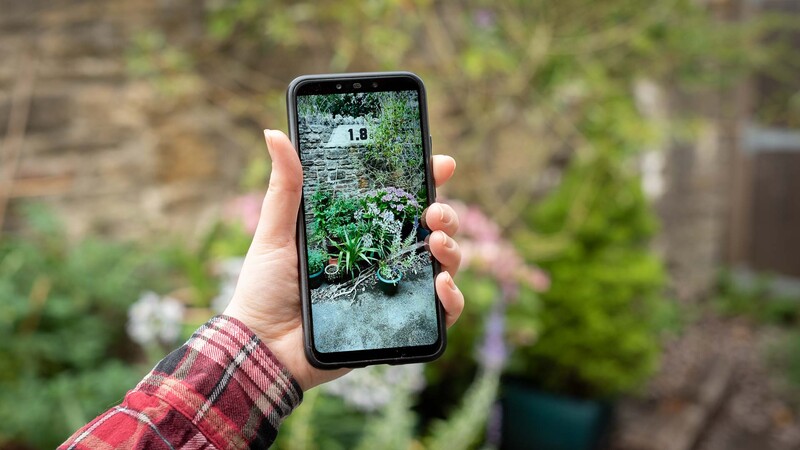 Smartphone in hand booting up